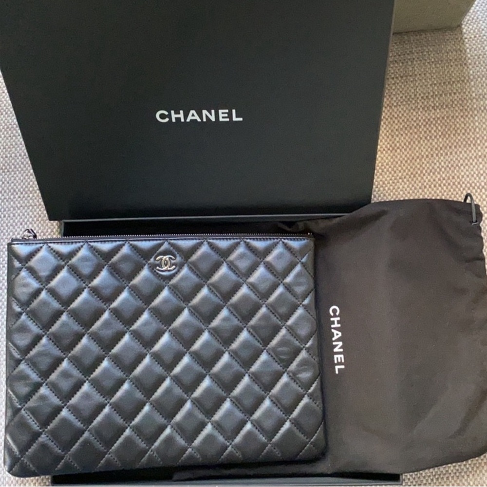CHANEL Quilted O-Case Clutch